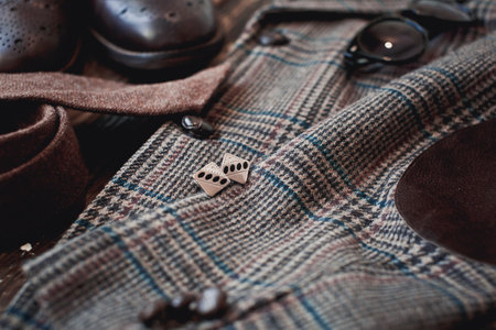 Fashionable men's clothing and accessories on a wooden background.