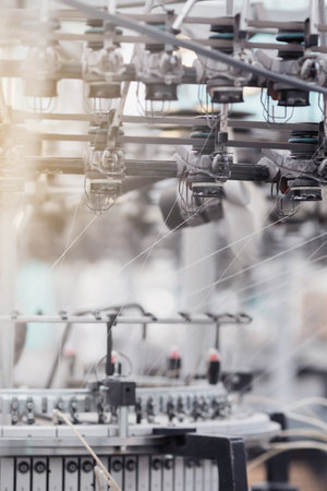 Close up of spinning machine in spinning production line. Selective focus.の写真素材