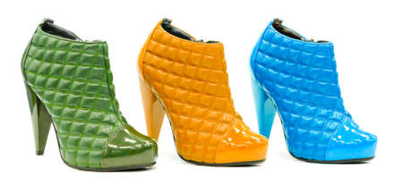 Three colorful leather stylish shoes with high heel and decorated with patent-leatherの写真素材