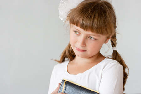 Cute preteen schoolgirl portrait near whiteboardの写真素材