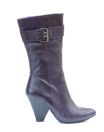 Purple female leather boot isolated on whiteの写真素材