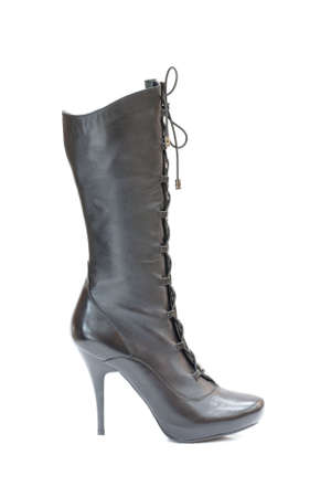 Black female leather boot isolated on whiteの写真素材