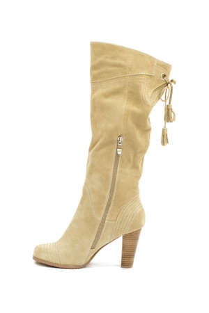 Beige female shammy boot isolated on whiteの写真素材