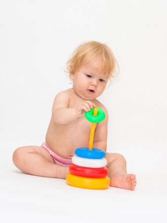 Baby girl playing colorful pyramidの写真素材
