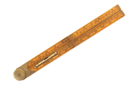 Antique carpenter's boxwood folding rule of 19th century marked Rabone with brass level and protractor isolated on whiteの写真素材