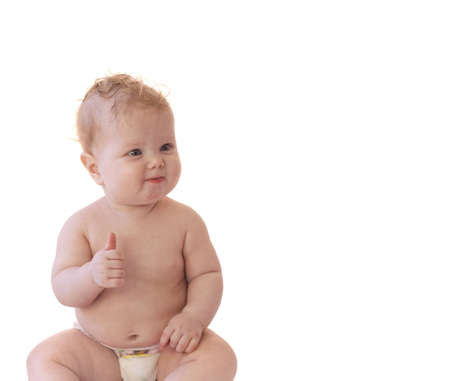 Baby girl with thumbs up isolatedの写真素材