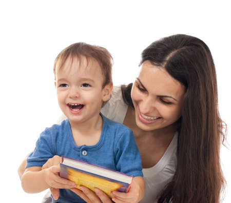 Mother and son reading book together isolated on whiteの写真素材