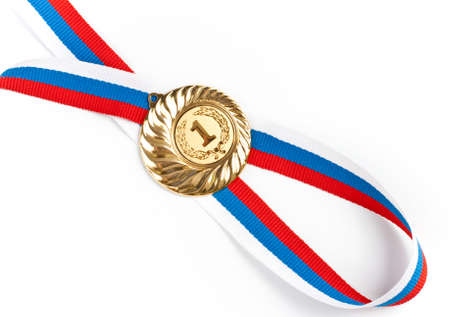 Golden medal isolated on whiteの写真素材