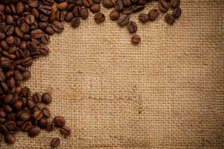 coffee beans on burlap background