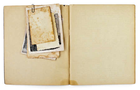 blank old opened diary or copybook with photos bunch isolated on whiteの写真素材