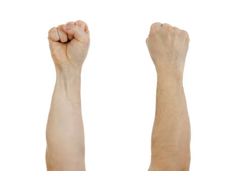 clinched fist raised up  isolated on whiteの写真素材