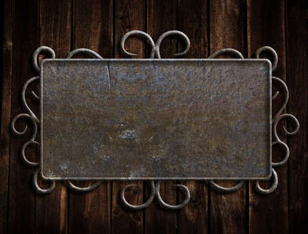 Vintage metal plate  on old oak doorの写真素材