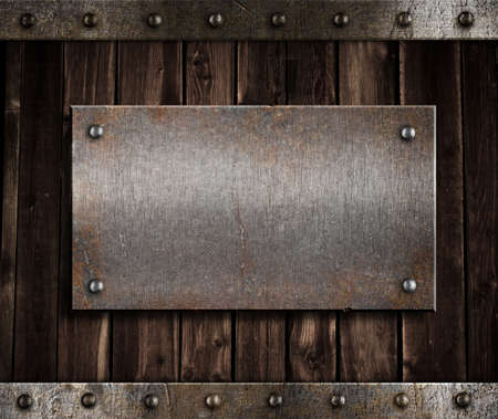 metal plate  on old wooden wall or doorの写真素材