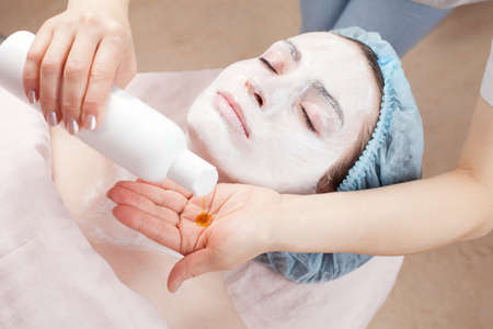 Beautiful woman with clear skin getting beauty treatment of her face at salon   Clear Skin 