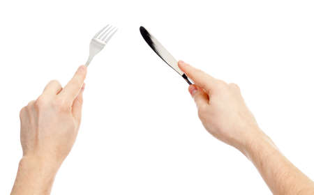 knife and fork cutlery in hands isolated