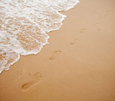 Footprints on sand of sea beachの写真素材