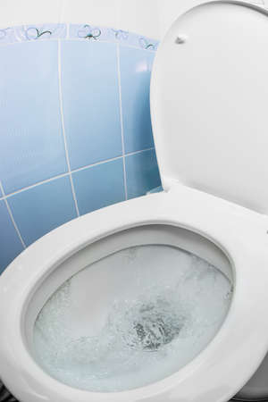water flushing in toilet bowl or sink or WCの写真素材