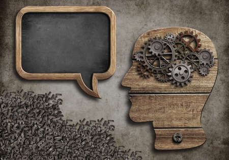 wooden head with speech bubble blackboardの写真素材