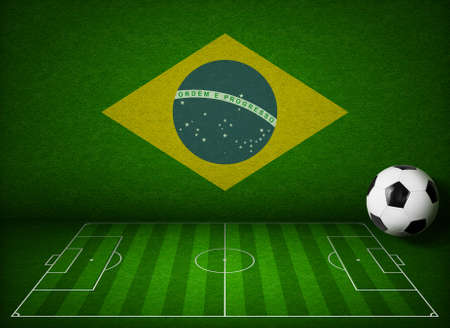 Soccer or football field with ball and flag of Brazilの写真素材
