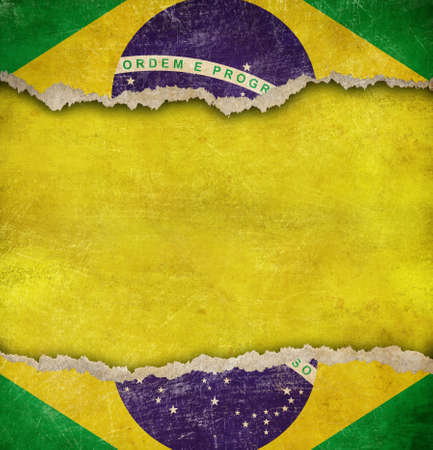 Torn cardboard or old teared paper grunge Brazil flagの写真素材