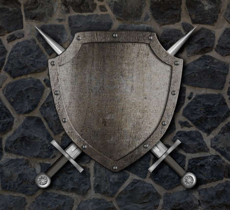Medieval shield and crossed swords on stone wallの写真素材