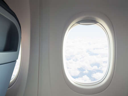 Airplane or jet interior with window and chair flight concept.の写真素材