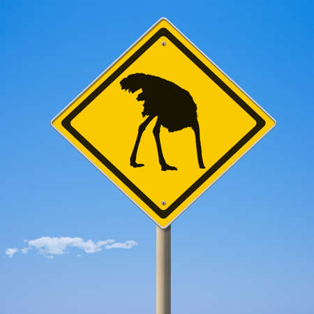 Warning ostrich ahead yellow road signの写真素材