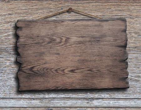 old wood plank or plate hanging on timber plank wall backgroundの写真素材