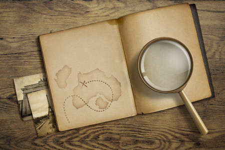 Adventure and travel theme. Diary with magnifying glass or loupe.