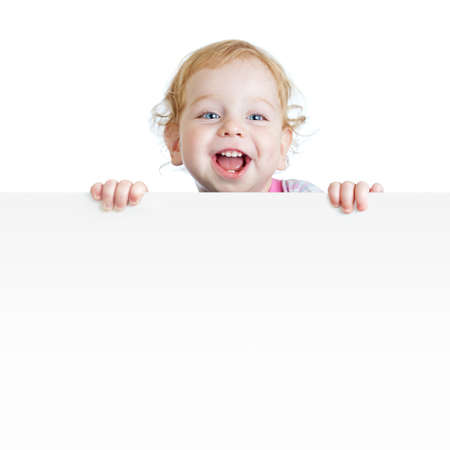 Baby boy showing blank placard with copy space isolatedの写真素材
