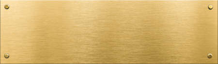 gold metal plaque or nameboard with rivetsの写真素材