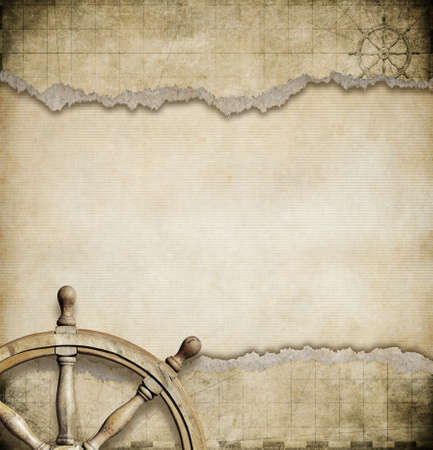 steering wheel and ripped nautical map backgroundの写真素材