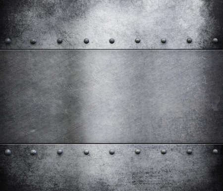 grunge metal armour with rivets backgroundの写真素材