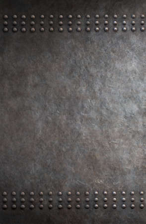 old metal armour with rivets backgroundの写真素材
