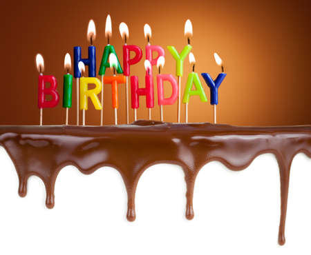 Happy birthday lit candles on chocolate cake templateの写真素材