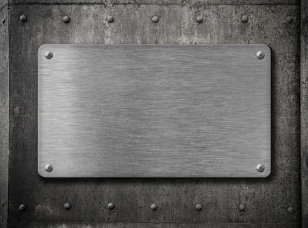 metal plate over old grunge rusty backgroundの写真素材