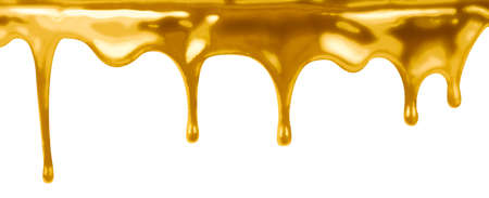 leaking gold paint isolated on whiteの写真素材