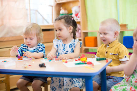 kids modeling or playing in kindergarten with interestの写真素材