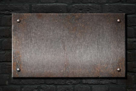 steel metal rusty plate over brick wall 3d illustrationの写真素材
