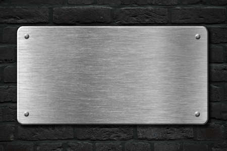 steel metal plate over brick wall 3d illustrationの写真素材