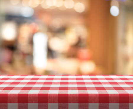 Cafe table with red checked tableclothの写真素材