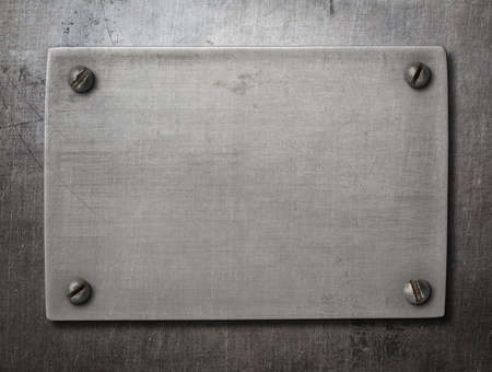 Old steel plate with bolts on metal backgroundの写真素材
