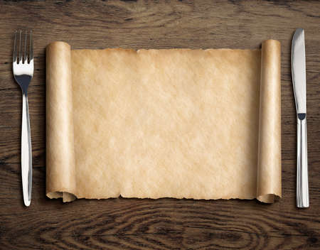 paper scroll with fork and knife on dinning tableの写真素材