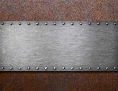 grunge steel plaque on rusty metal background