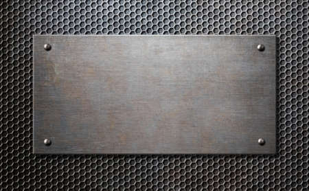 metal plaque with rivets over comb grid backgroundの写真素材