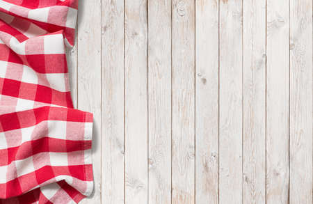 red picnic cloth on white wood tableの写真素材