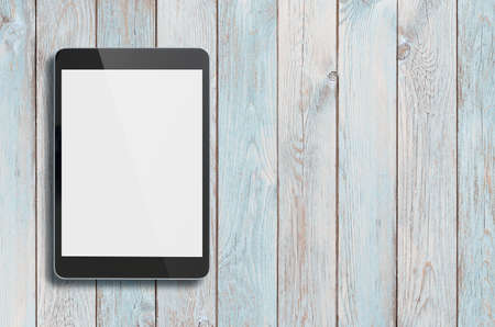 Tablet pc on old wood table
