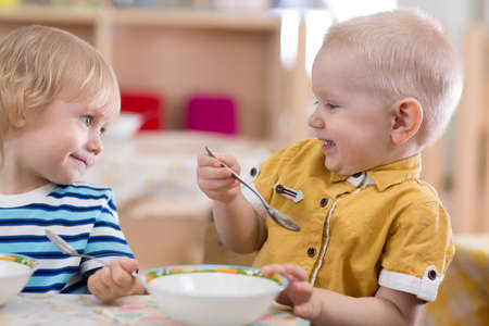 Children eating in kindergartenの写真素材