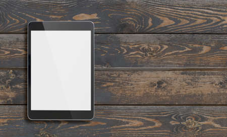 Black tablet pc with blank screen on old wood tableの写真素材