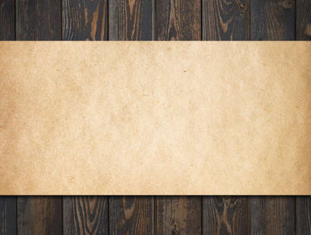 Dark wood background with old paperの写真素材